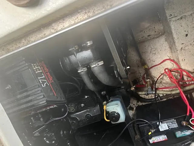 Slide: The Image of Engine compartment of a 1997 Monterey 296 Cruiser with visible wiring and components. - 23