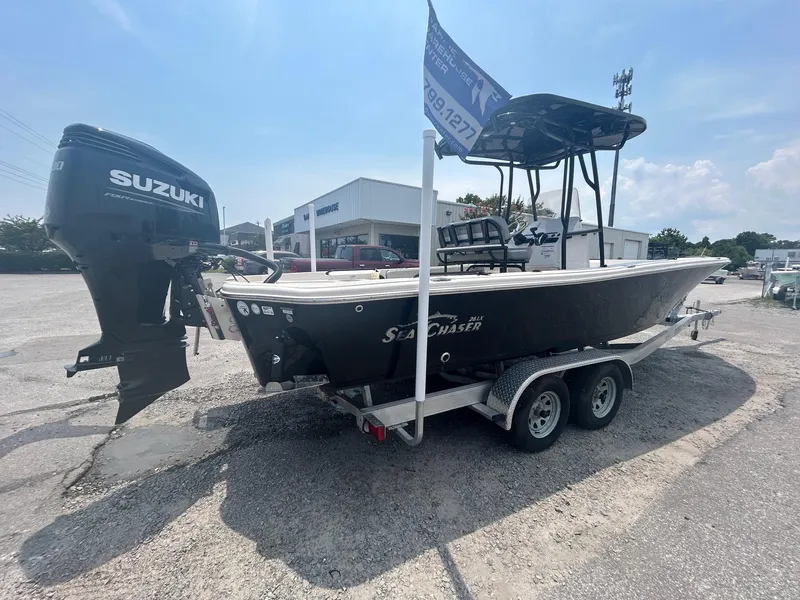 Slide: The Image of 2025 Sea Chaser 26 LX boat on trailer with Suzuki outboard motor. - 4