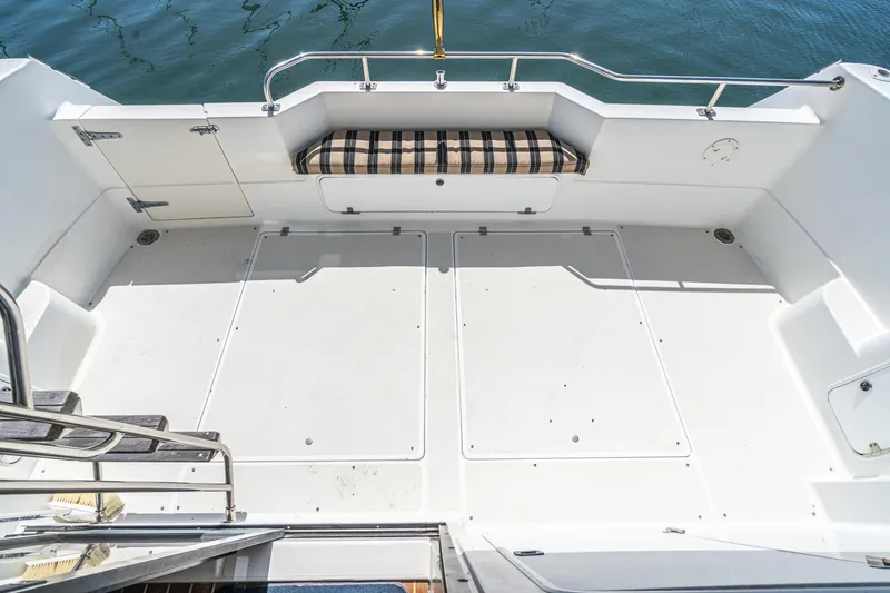 Slide: The Image of 1992 Bayliner 4388 boat deck with seating, overlooking calm water. - 20