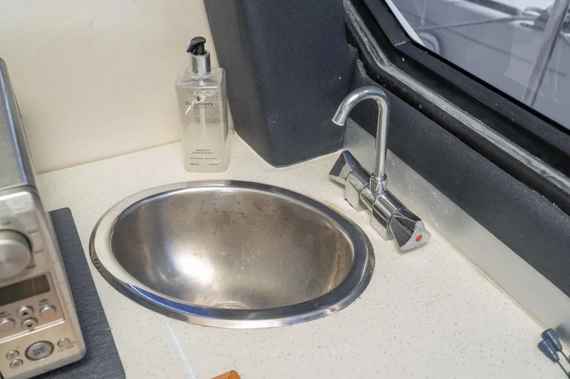 Slide: The Image of Stainless steel sink and faucet in 1992 Bayliner 4388 yacht kitchen area. - 31