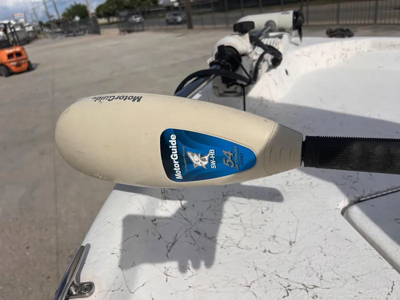 Slide: The Image of MotorGuide trolling motor on 2010 Blue Wave 160 V Bay boat, outdoor setting. - 11