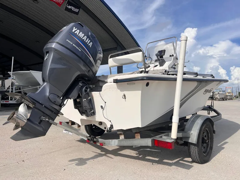 Slide: The Image of 2010 Blue Wave 160 V Bay boat with Yamaha outboard motor on trailer. - 3