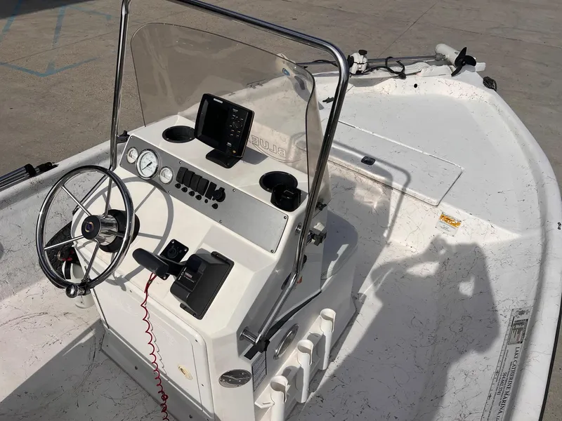 Slide: The Image of 2010 Blue Wave 160 V Bay boat interior with steering wheel and control panel. - 6