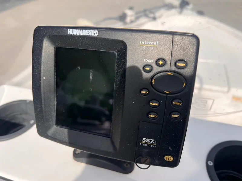 Slide: The Image of Humminbird fishfinder GPS on 2010 Blue Wave 160 V Bay boat dashboard. - 7