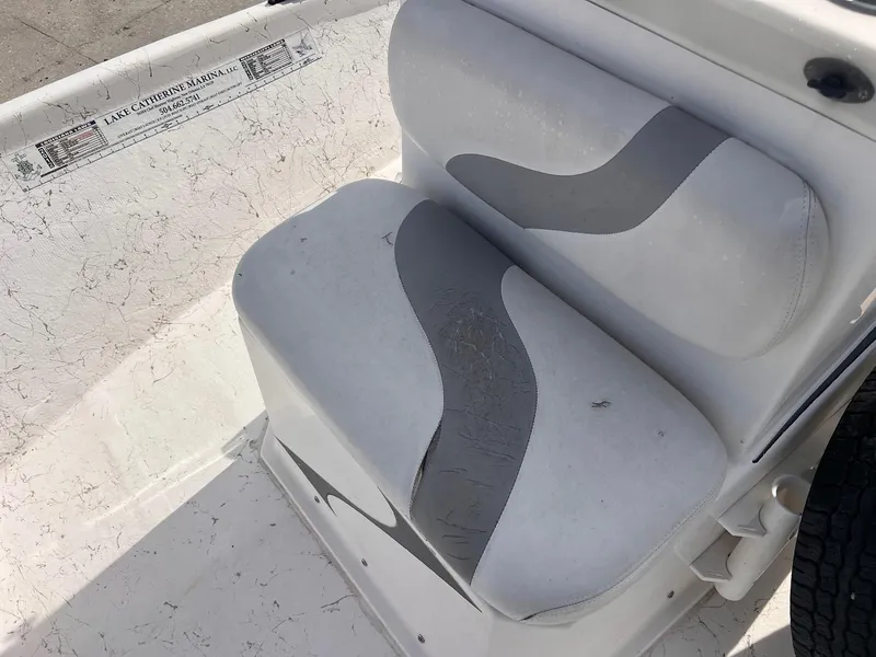 Slide: The Image of White and gray boat seat in a 2010 Blue Wave 160 V Bay. - 8