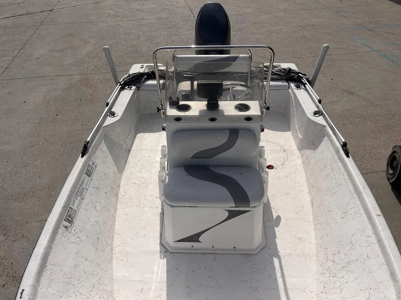 Slide: The Image of 2010 Blue Wave 160 V Bay boat interior with steering console and seating. - 9