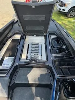 Slide: The Image of 2026 Skeeter ZXE20 boat interior with open storage compartments and organized tackle boxes. - 3