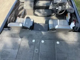 Slide: The Image of 2026 Skeeter ZXE20 boat interior with seating and steering wheel, viewed from above. - 7