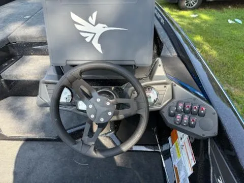 Slide: The Image of 2026 Skeeter ZXE20 boat dashboard with steering wheel and control panel. - 8