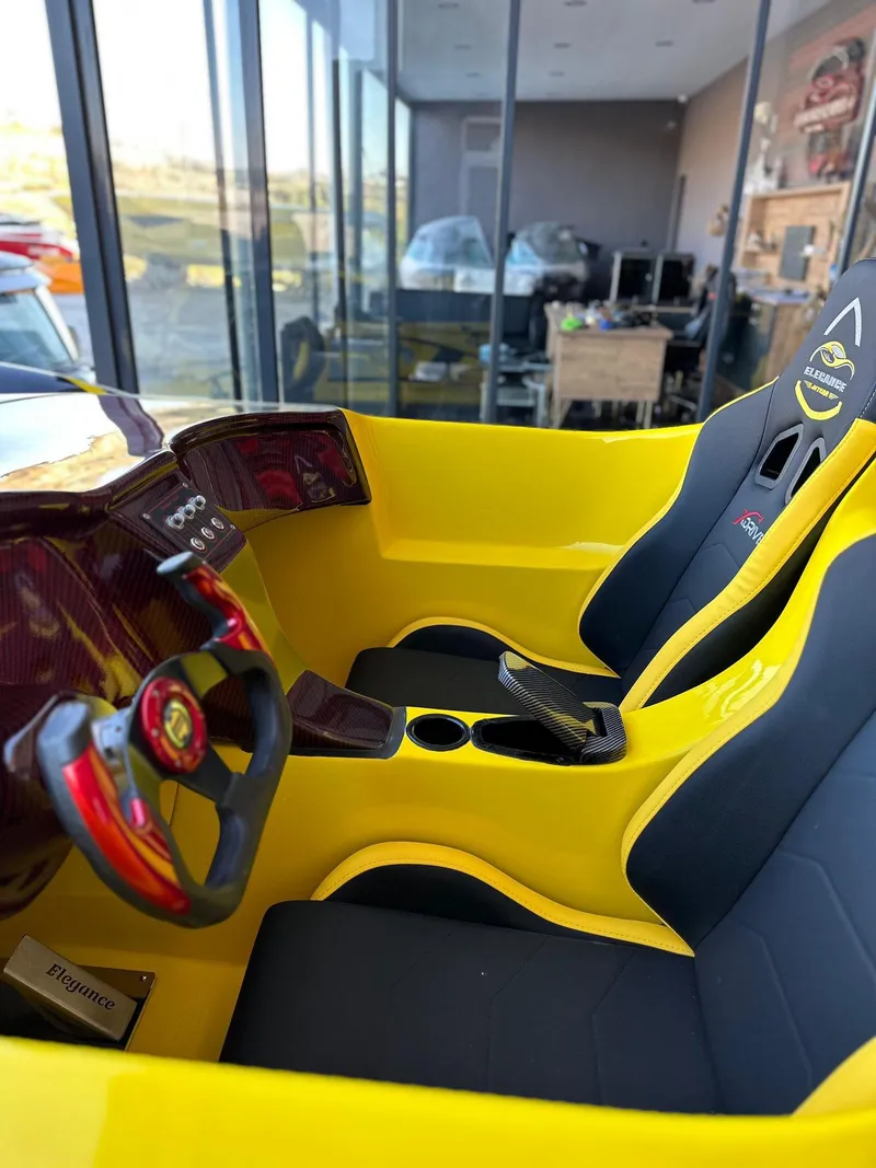 Slide: The Image of Interior of 2025 Fabbro Jet Car RR, featuring sleek yellow design and modern dashboard. - 36