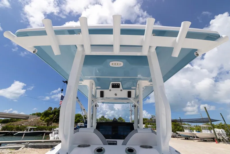 Slide: The Image of 2026 Sea Fox 288 Commander boat with sleek design and modern features under a blue sky. - 13