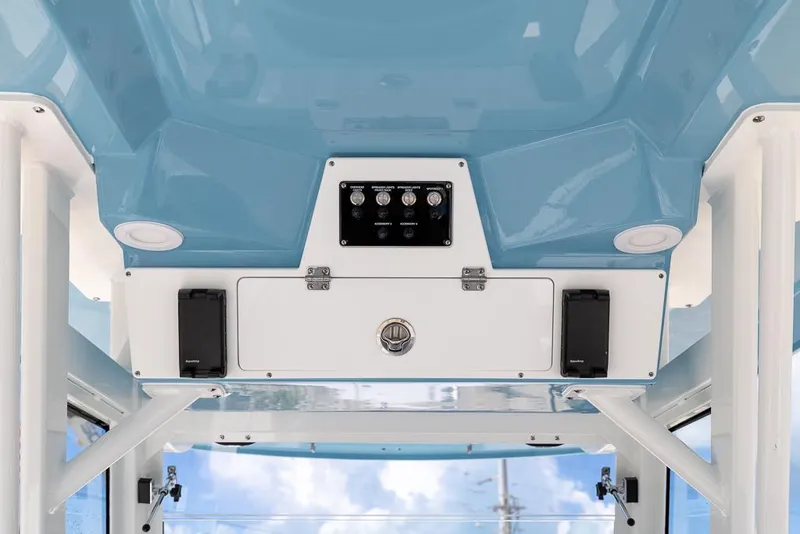 Slide: The Image of 2026 Sea Fox 288 Commander boat interior, featuring blue ceiling and control panel. - 14
