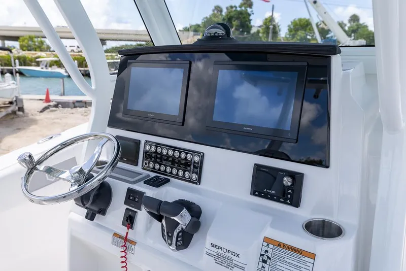 Slide: The Image of Helm of 2026 Sea Fox 288 Commander with dual screens and modern controls. - 17