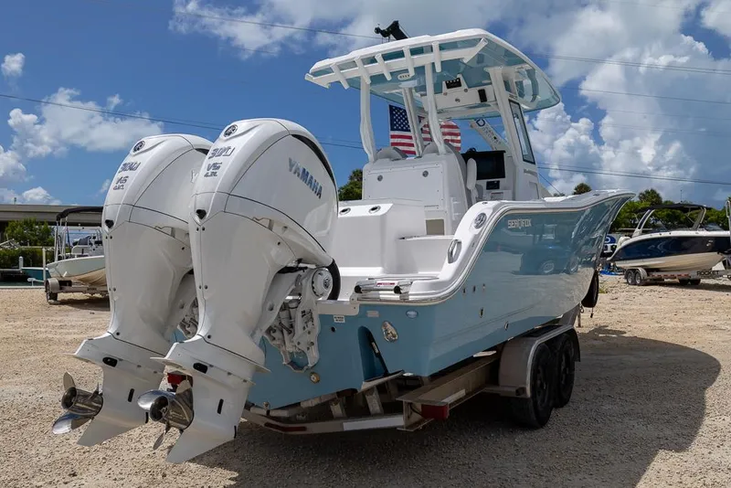 Slide: The Image of 2026 Sea Fox 288 Commander boat with twin Yamaha engines on a trailer. - 4