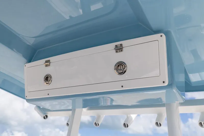 Slide: The Image of 2026 Sea Fox 288 Commander storage compartment with blue finish and secure latches. - 15
