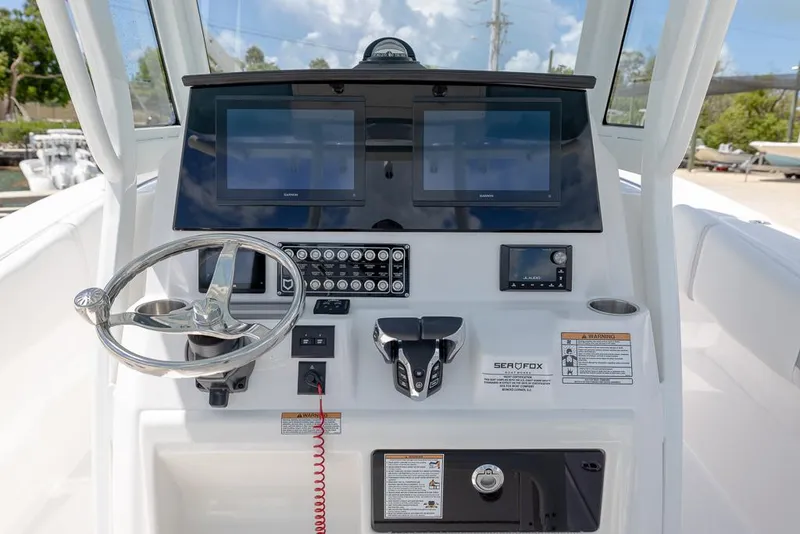 Slide: The Image of 2026 Sea Fox 288 Commander helm with dual screens and modern controls. - 16