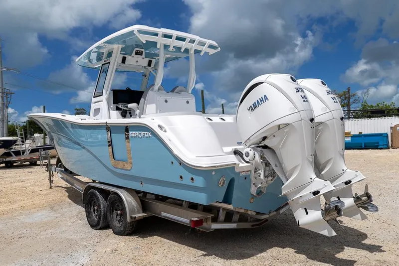 Slide: The Image of 2026 Sea Fox 288 Commander boat with twin Yamaha engines on a trailer. - 2
