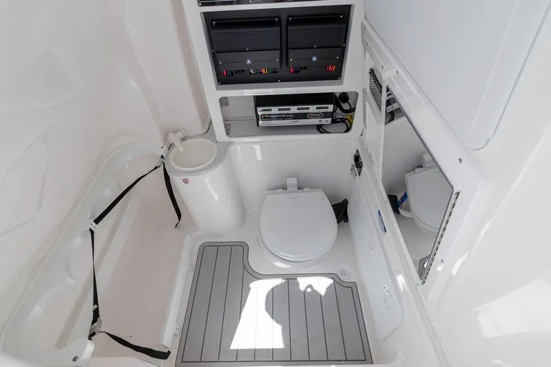Slide: The Image of 2026 Sea Fox 288 Commander boat bathroom with toilet, storage, and sleek design. - 23