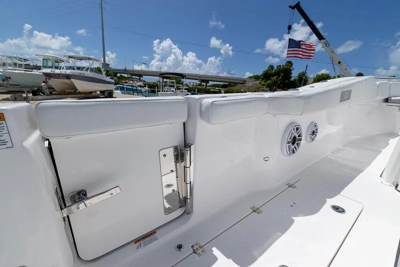 Slide: The Image of 2026 Sea Fox 288 Commander boat interior with speakers and American flag in background. - 25