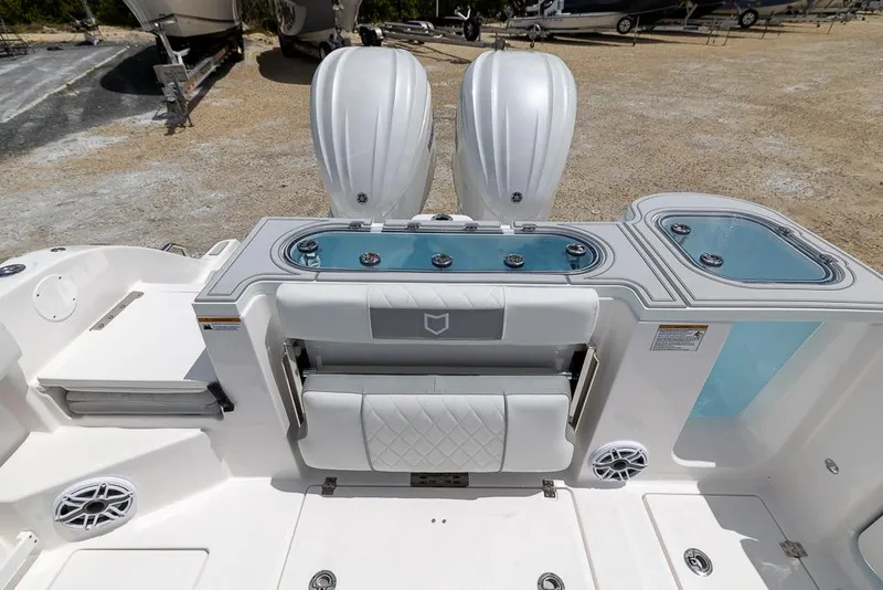 Slide: The Image of 2026 Sea Fox 288 Commander boat interior with dual engines and seating area. - 7