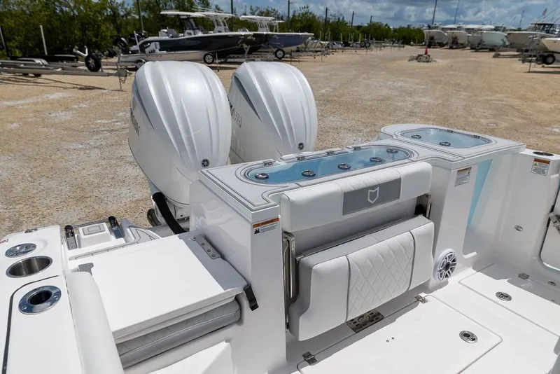 Slide: The Image of 2026 Sea Fox 288 Commander boat with dual engines and sleek white seating. - 8