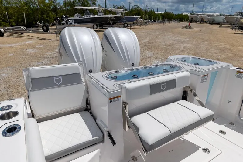Slide: The Image of 2026 Sea Fox 288 Commander boat interior with dual engines and cushioned seating. - 9