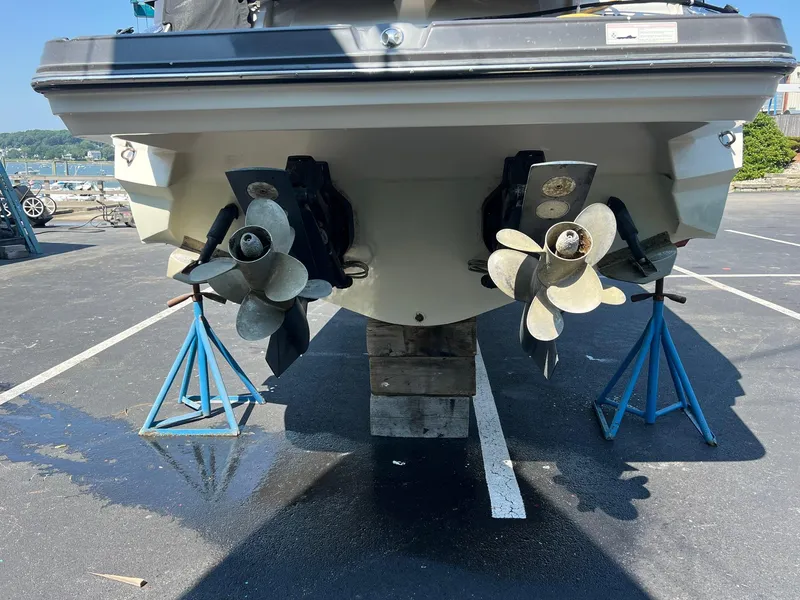 Slide: The Image of 2014 Monterey 328 Super Sport boat on stands, showing dual propellers. - 27