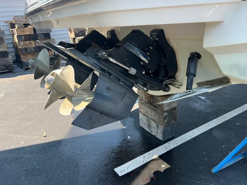 Slide: The Image of 2014 Monterey 328 Super Sport boat propeller and stern drive on blocks. - 29