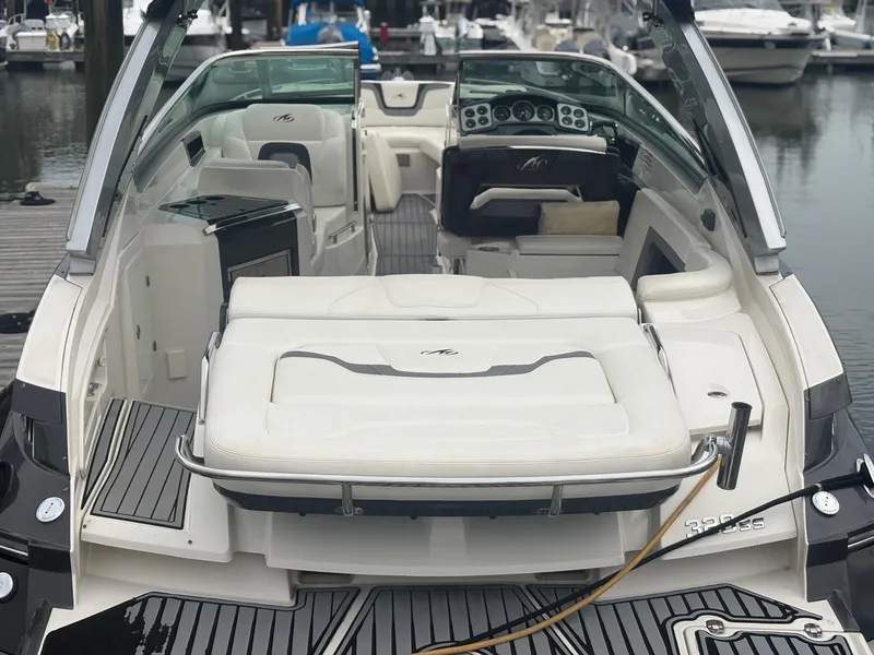 Slide: The Image of 2014 Monterey 328 Super Sport boat interior at a marina dock. - 8