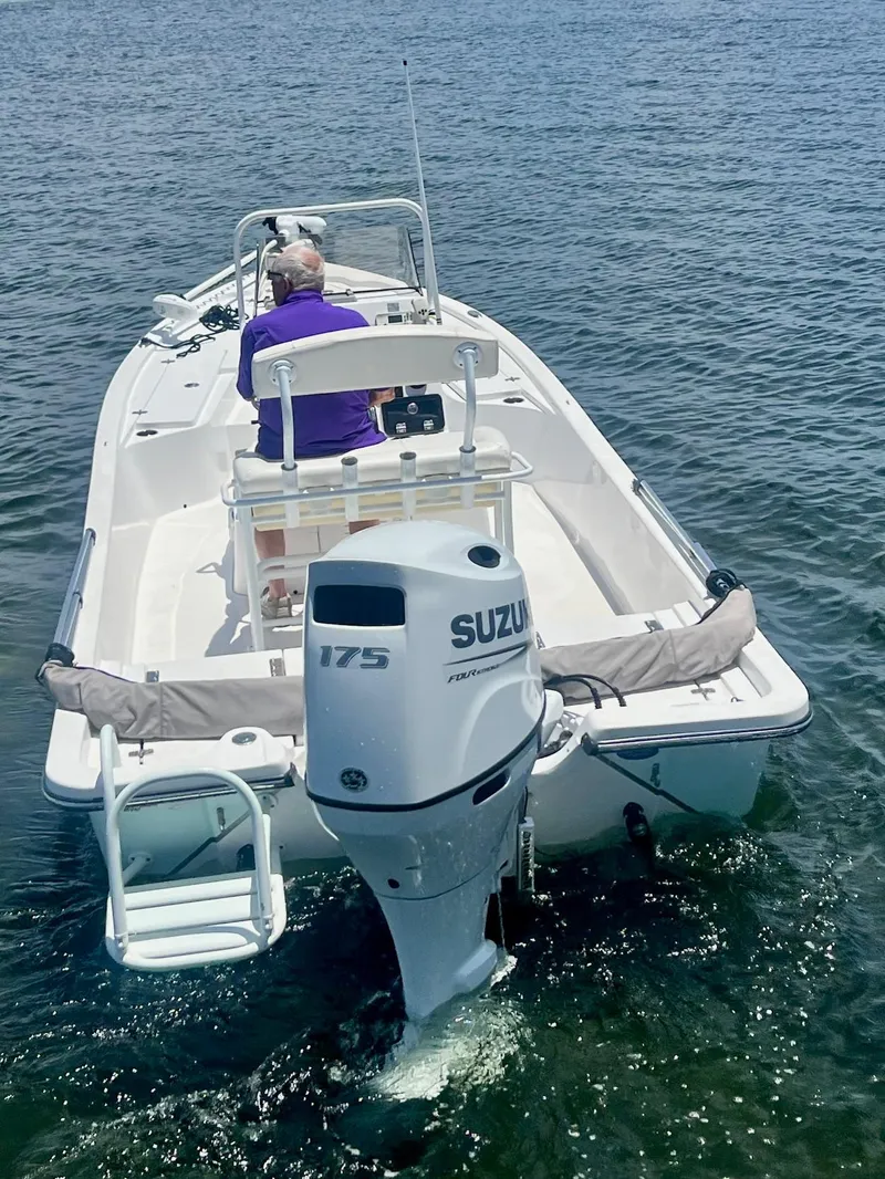 Slide: The Image of 2021 Blazer Bay 2200 boat with Suzuki 175 engine on open water. - 8