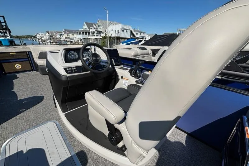 Slide: The Image of 2026 Barletta C24M boat interior with modern helm and luxurious seating. - 10