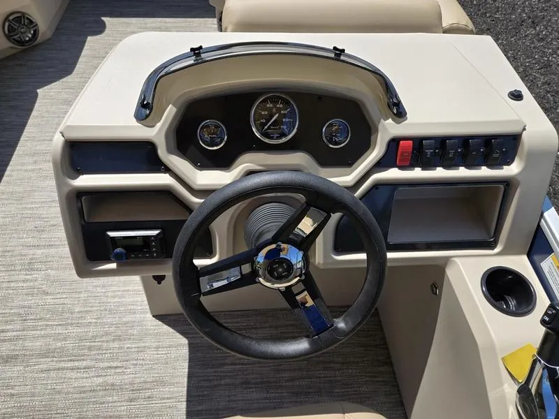 Slide: The Image of Steering console of 2026 Godfrey Xperience 2286 SBX Sport Tube boat, featuring gauges and controls. - 14