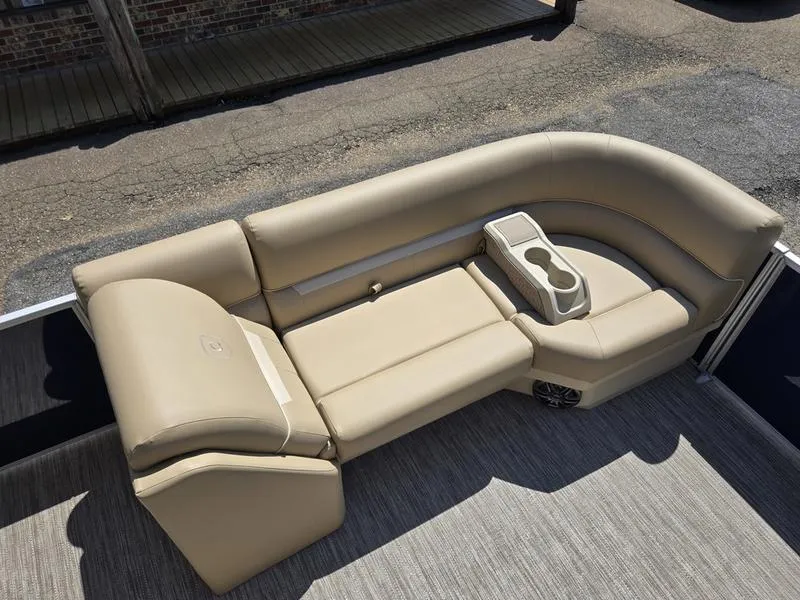Slide: The Image of Beige seating on 2026 Godfrey Xperience 2286 SBX Sport Tube boat, featuring cup holders and speaker. - 8