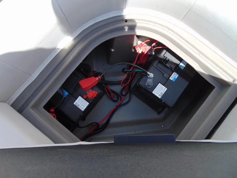 Slide: The Image of Battery compartment of 2022 Godfrey Sweetwater 1880 CX boat, showing wiring and connections. - 16