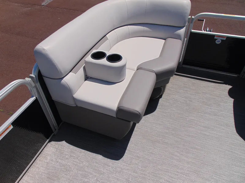 Slide: The Image of 2022 Godfrey Sweetwater 1880 CX boat seating with cup holders, featuring light gray upholstery. - 18