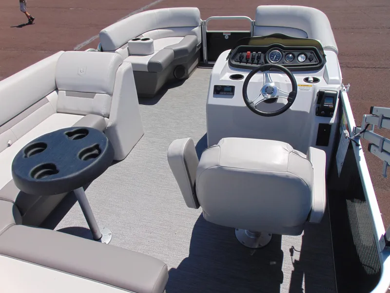 Slide: The Image of Interior of 2022 Godfrey Sweetwater 1880 CX pontoon boat with seating and steering console. - 6