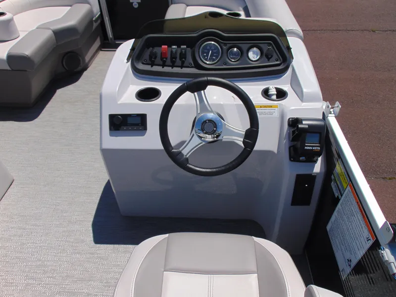 Slide: The Image of 2022 Godfrey Sweetwater 1880 CX boat dashboard with steering wheel and control panel. - 8