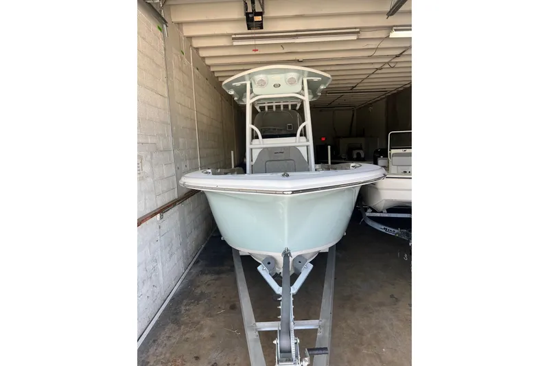 Slide: The Image of 2024 Sea Pro 222 Center Console boat in storage, front view. - 4