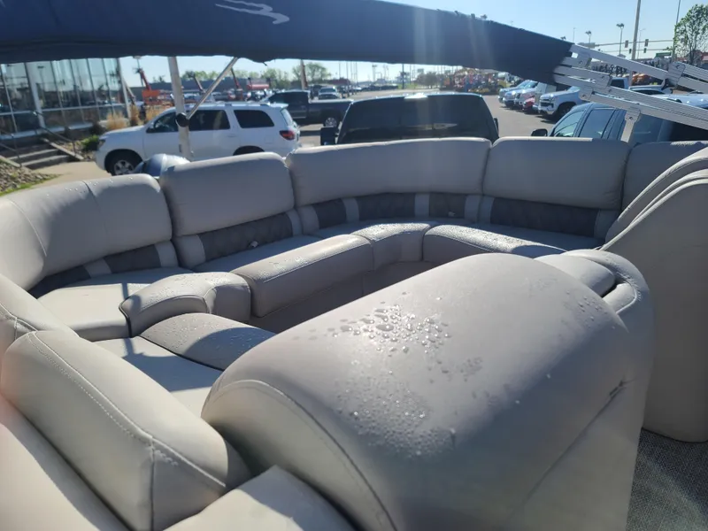 Slide: The Image of Luxurious seating on a 2017 Bennington R23 boat, with water droplets and a sunshade. - 11