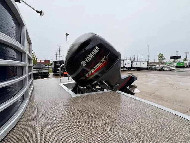 Slide: The Image of 2017 Bennington R23 boat with Yamaha outboard motor in a parking lot. - 13