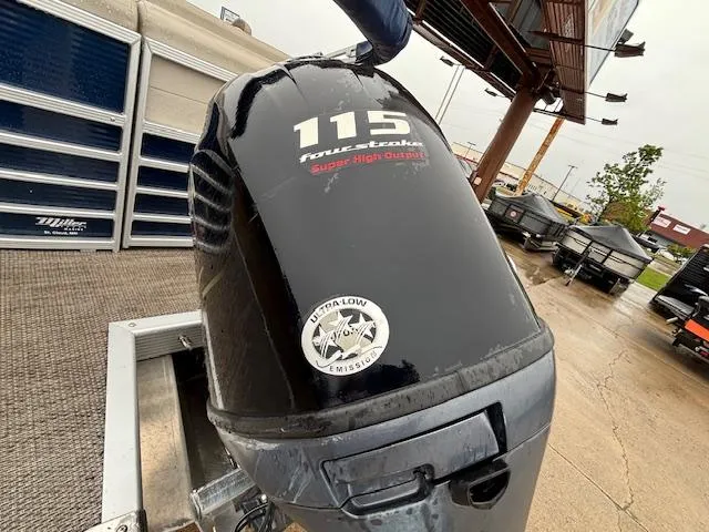 Slide: The Image of Outboard motor on a 2017 Bennington R23 boat, featuring 115 horsepower and ultra-low emissions. - 14