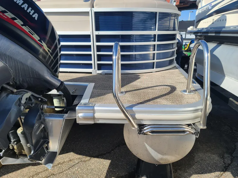 Slide: The Image of 2017 Bennington R23 pontoon boat with Yamaha outboard motor and swim ladder. - 6