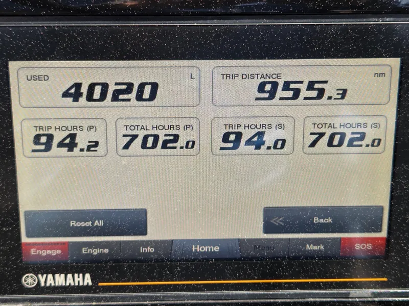 Slide: The Image of Yamaha display showing trip data: 4020L used, 955.3 nm distance, 702 total hours. - 20