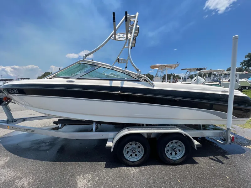 Slide: The Image of 2004 MasterCraft MariStar 210 VRS boat on trailer under clear blue sky. - 1