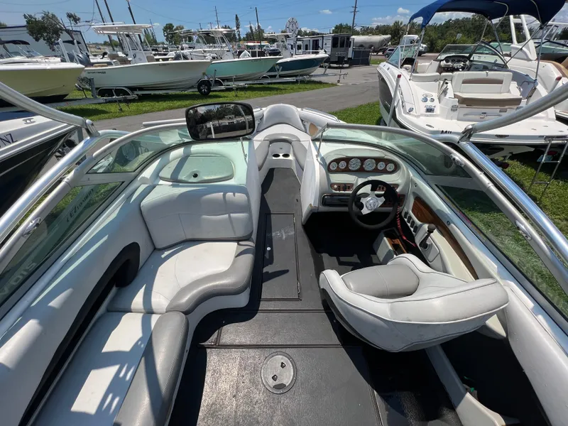 Slide: The Image of 2004 MasterCraft MariStar 210 VRS boat interior with seating and dashboard view. - 12