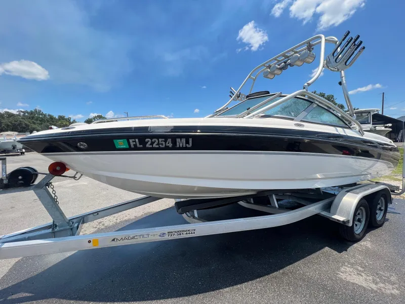 Slide: The Image of 2004 MasterCraft MariStar 210 VRS boat on trailer, sunny day, clear sky. - 2