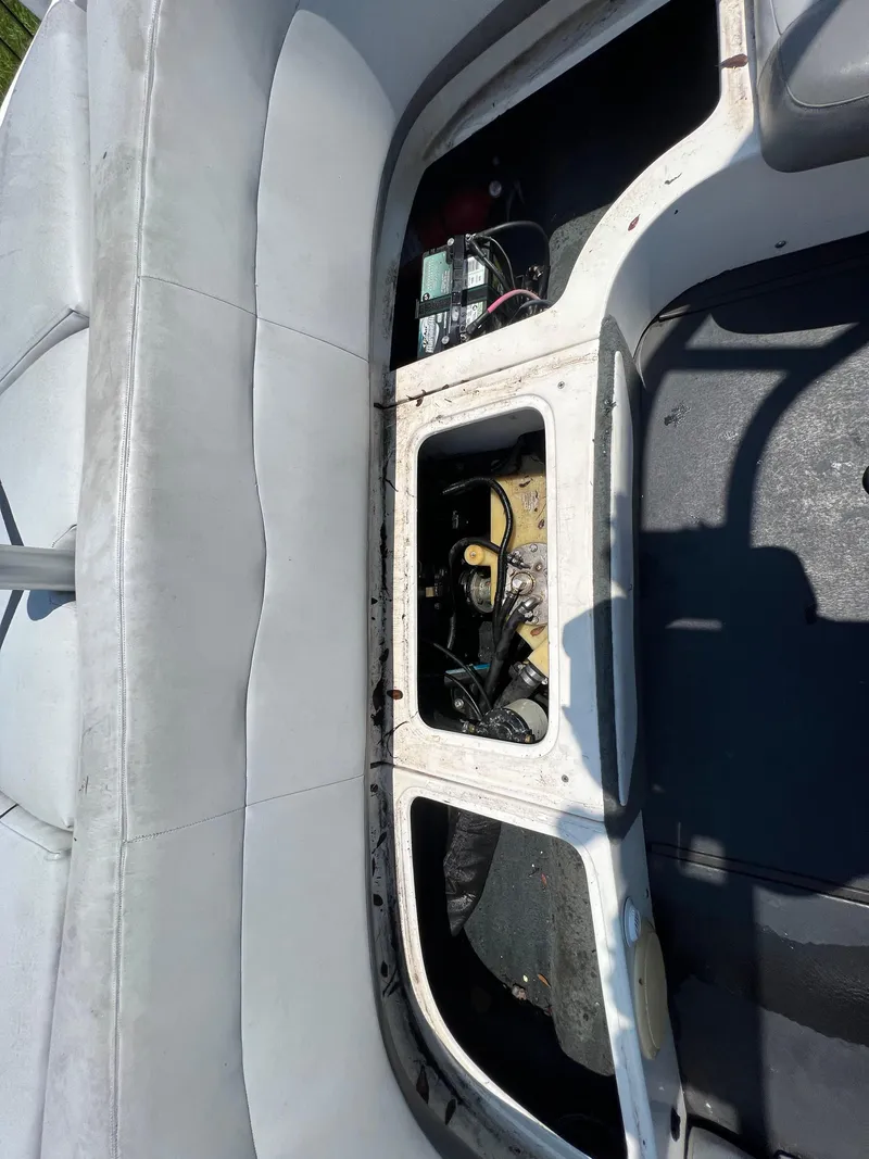 Slide: The Image of 2004 MasterCraft MariStar 210 VRS boat interior showing open engine compartment. - 25