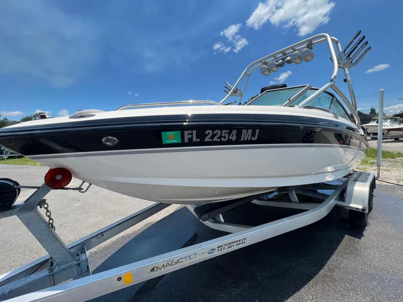 Slide: The Image of 2004 MasterCraft MariStar 210 VRS boat on trailer under clear blue sky. - 3