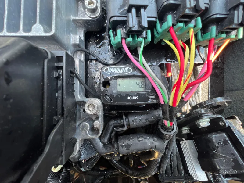 Slide: The Image of Close-up of 2004 MasterCraft MariStar 210 VRS engine wiring and hour meter display. - 32