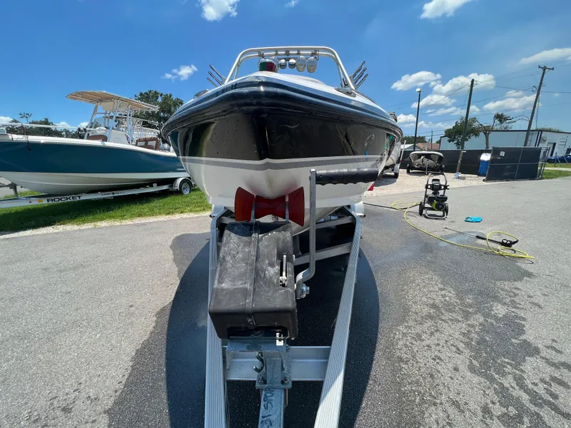Slide: The Image of 2004 MasterCraft MariStar 210 VRS boat on trailer under clear blue sky. - 4